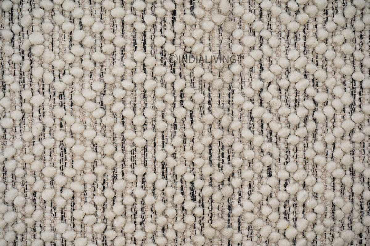 Hand knotted chunky wool rug flat lay