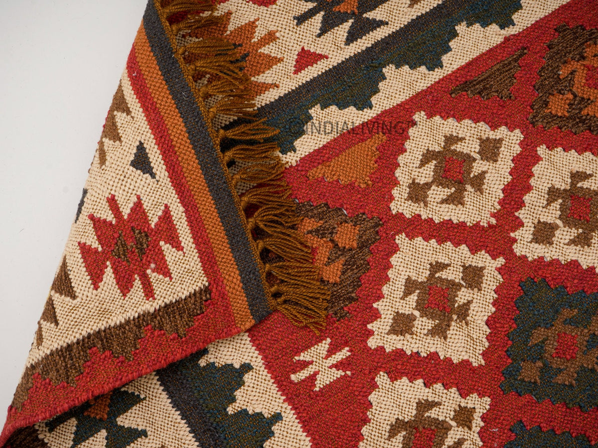Overhead view of Aztec-inspired pattern on red rug