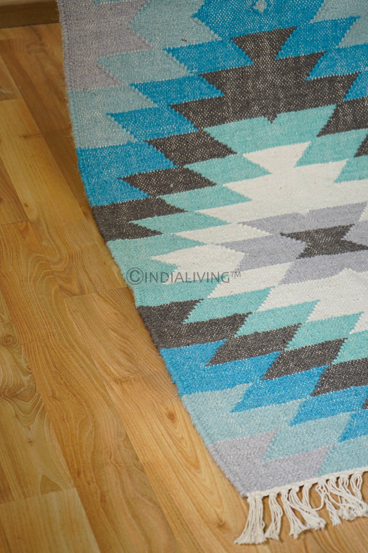 Close-up of kilim weave texture in blue runner