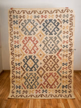 Colourful jute rug placed under furniture in room