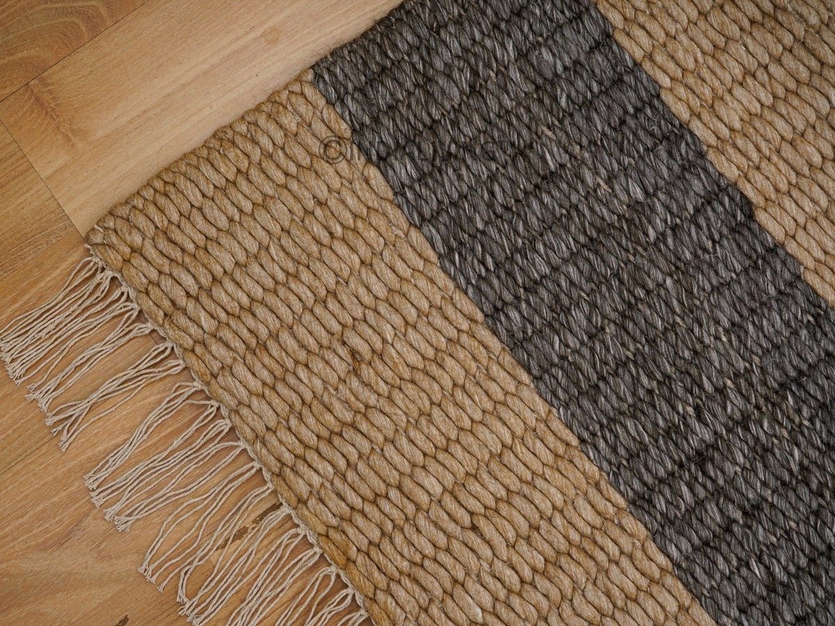 Charcoal and beige striped chunky wool rug corner detail