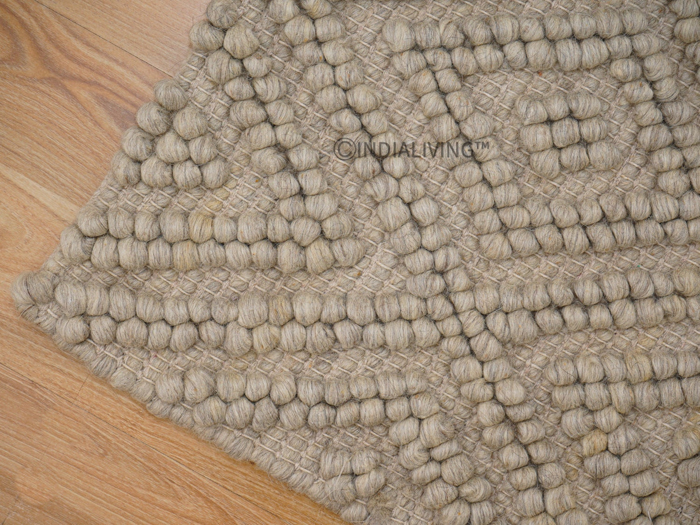 Beige chunky wool rug flat lay