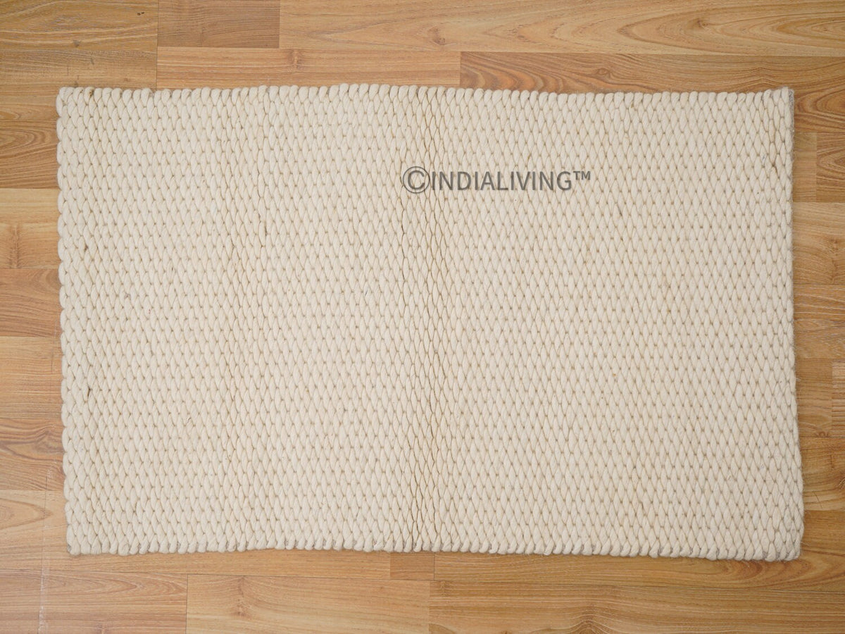 Close-up of ivory chunky wool loop texture