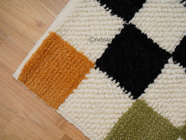 Checkered wool rug styled in a living room