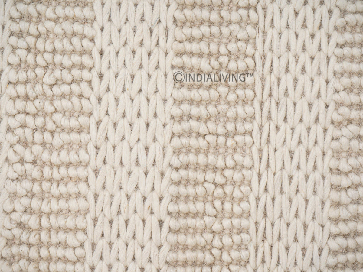 Ivory hand knotted chunky wool rug flat lay