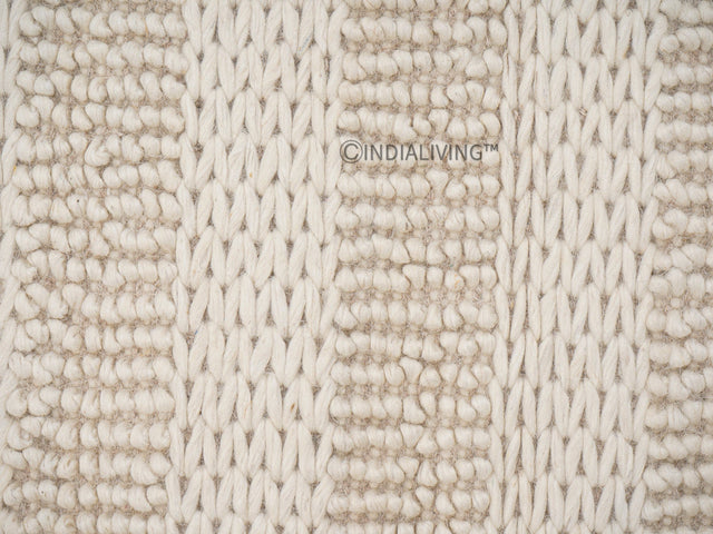 Ivory hand knotted chunky wool rug flat lay