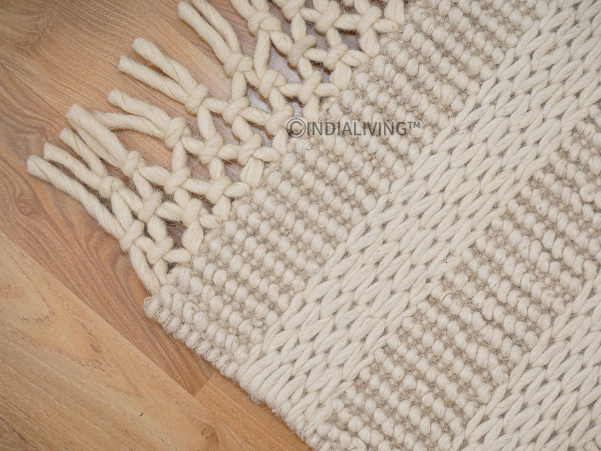Ivory wool rug styled in a living room