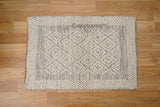Chunky wool rug corner and edge detail