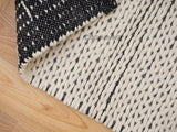 Close-up of hand knotted braided wool loop texture