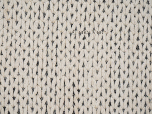 Ivory chunky wool rug styled in a living room setting