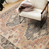 Overhead view of vintage faded pattern on kilim rug