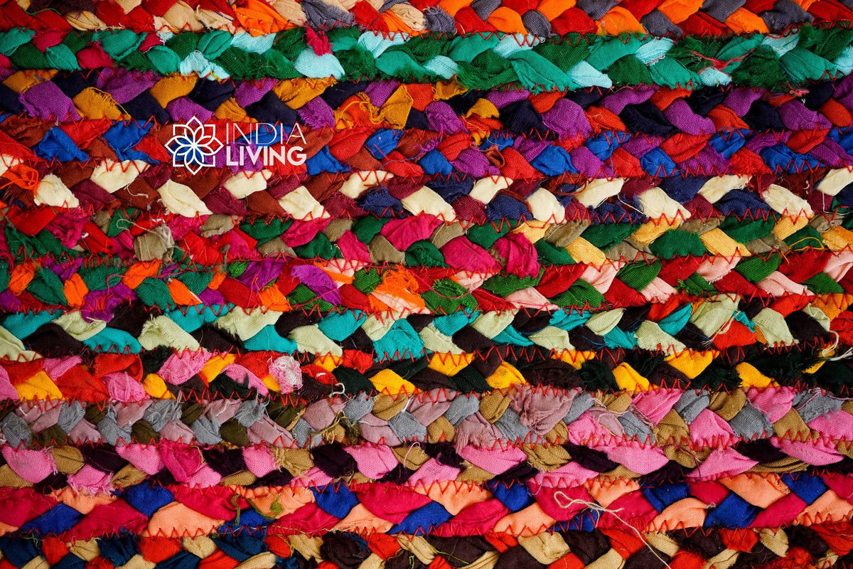 Rainbow rag rug styled in a bedroom