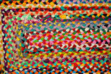 Corner detail of rainbow rag rug edge
