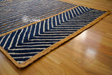 Jute rug corner detail showing blue braid