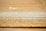 White bordered jute hemp rug pile close-up
