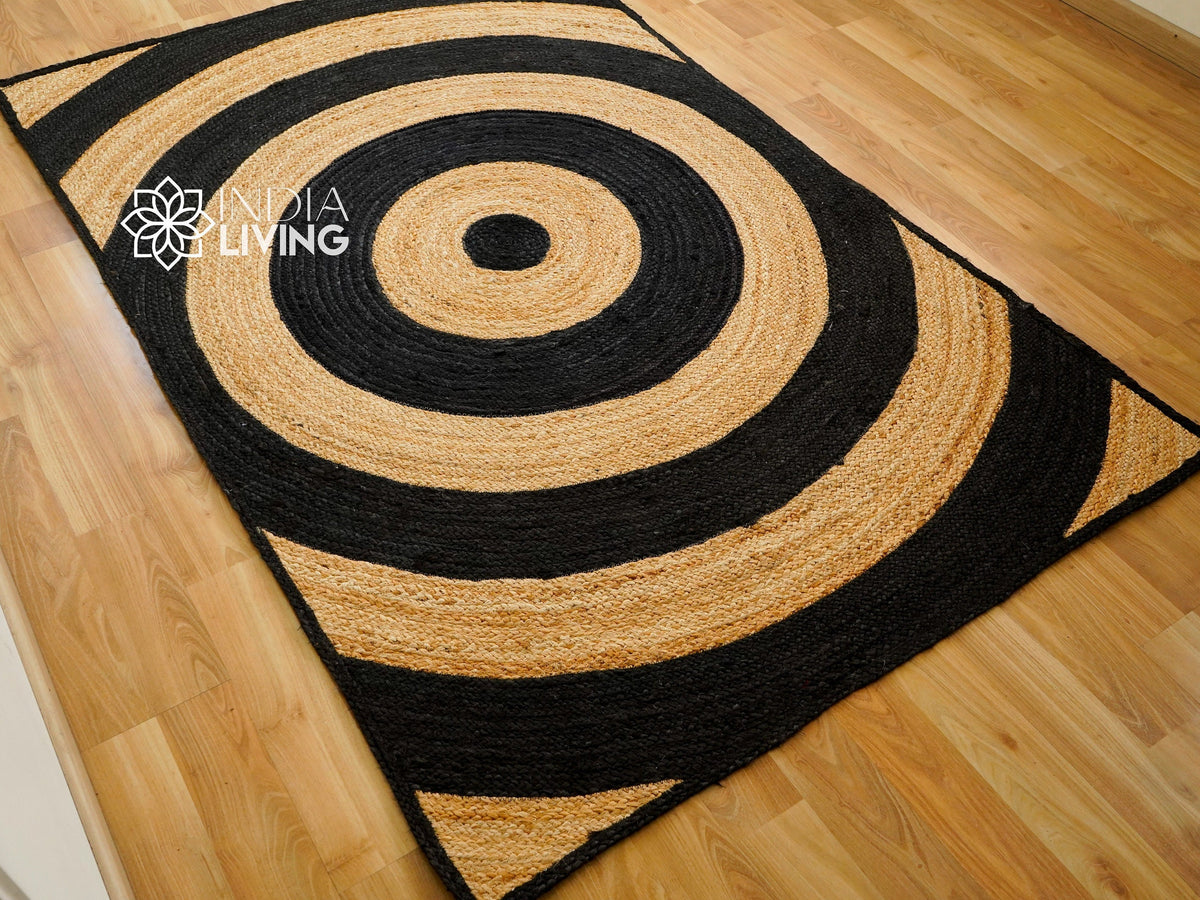 Black ring jute rug styled with furniture in room