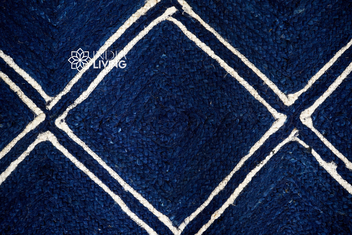 Navy jute rug styled with furniture in room