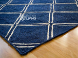 Navy blue jute rug in a boho styled room