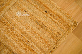Handwoven jute area rug braided edge detail