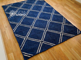 Navy jute rug in a bedroom setting