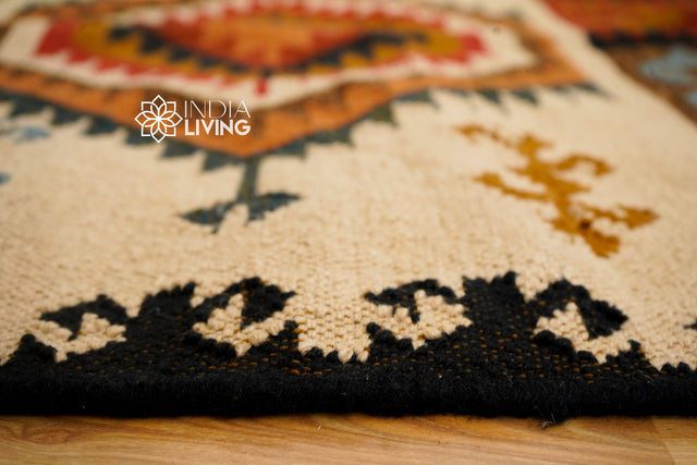 Beige southwestern kilim rug styled on porch
