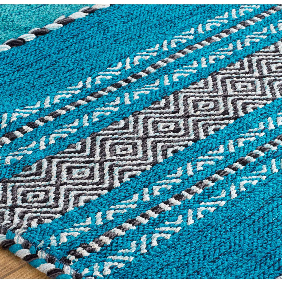 Teal blue kilim rug pile close-up texture