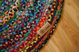 Round rag rug styled in a bedroom