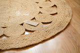 Round jute rug in living room setting