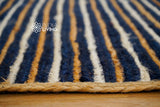 Blue jute rug styled with coastal decor