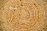 Round jute mat in living room setting