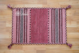 Pink kilim rug diamond pattern view