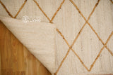 White jute rug in entryway setting