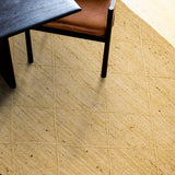 Ivory jute braided rug flat lay