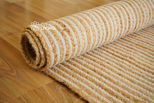 White jute rug styled in a living room
