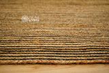 Jute rug styled in bedroom