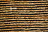 Black striped jute rug pile close-up
