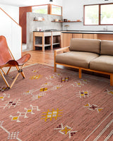 Pink kilim rug in bedroom setting