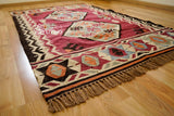 Close-up of red kilim rug geometric weave