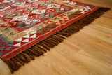 Red traditional kilim rug full view