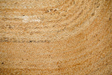 Natural jute oval rug styled with rustic farmhouse decor