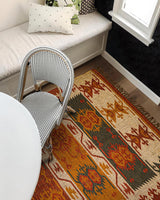 Red Navajo kilim runner styled in a hallway