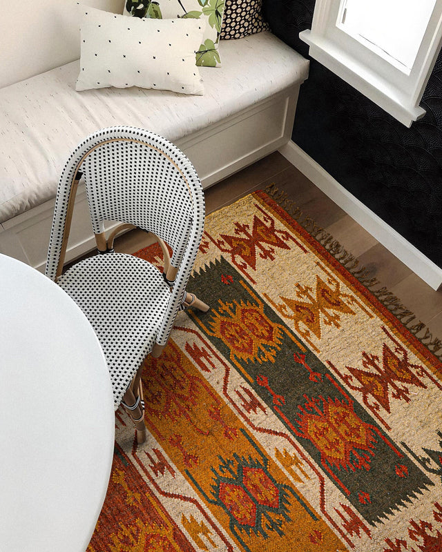 Red Navajo kilim runner styled in a hallway