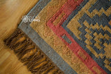 Navajo kilim rug laid as a hallway runner
