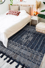 Denim blue kilim rug styled on a patio