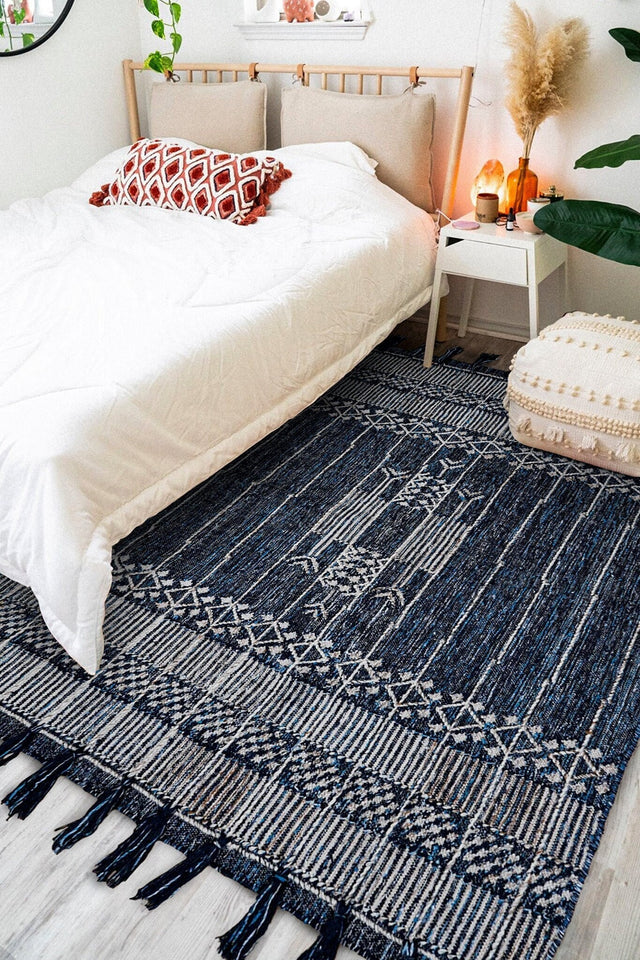 Denim blue kilim rug styled on a patio