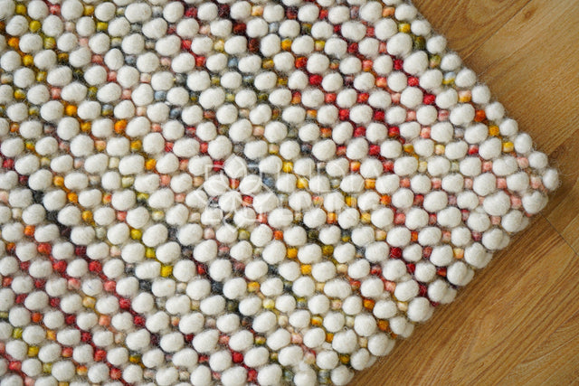 Colorful chunky loop wool rug, flat lay view