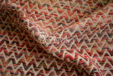 Abstract wool rug styled in a kids room setting