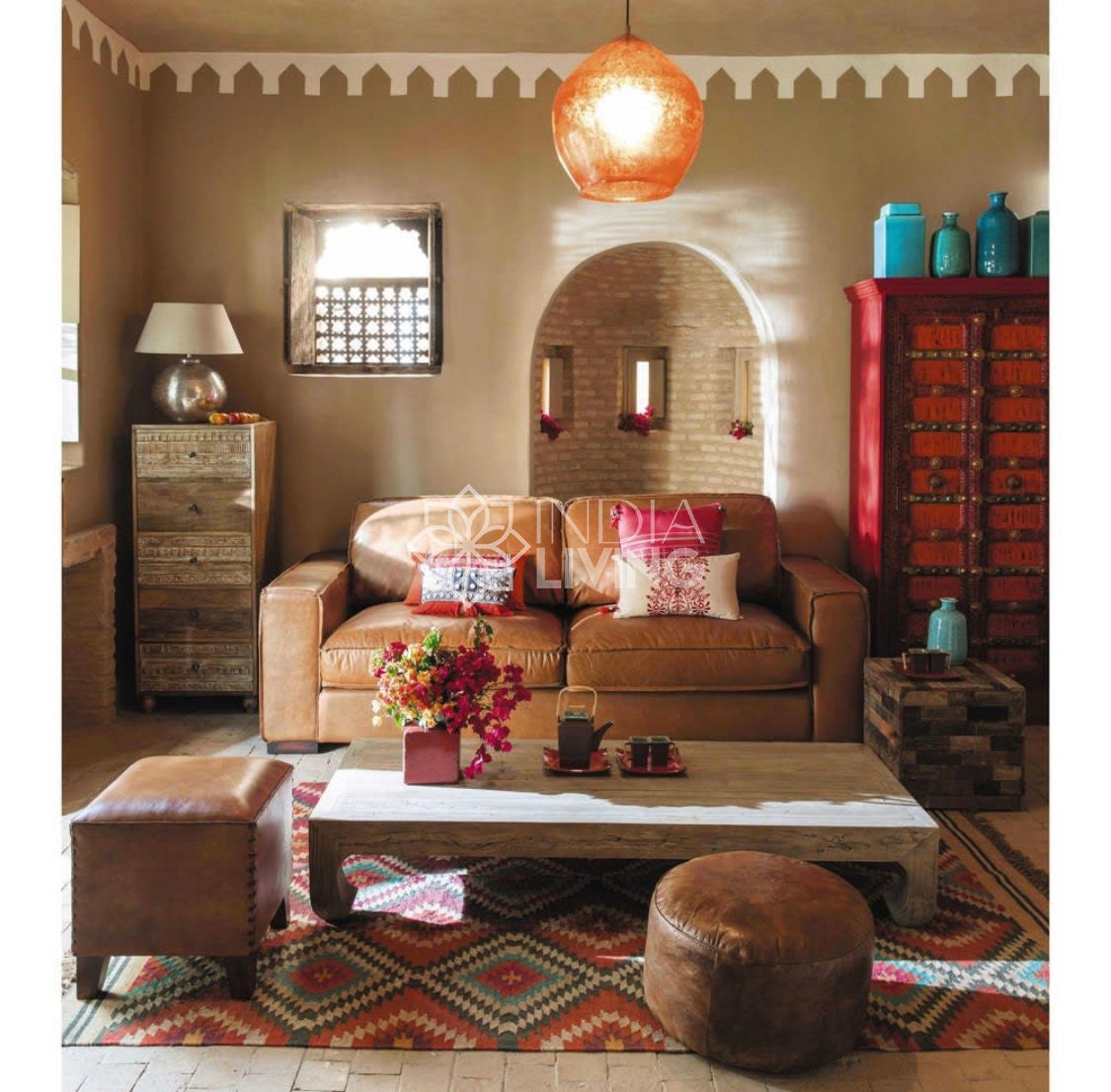 Rainbow diamond pattern rug styled near a sofa