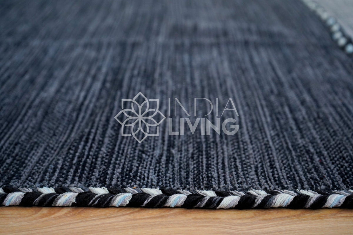 Grey kilim rug styled with matching cushions