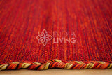 Overhead view of red diamond kilim rug